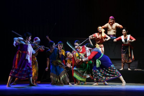 Birubala being attacked by the hostile mob when she rescues the victimised girls